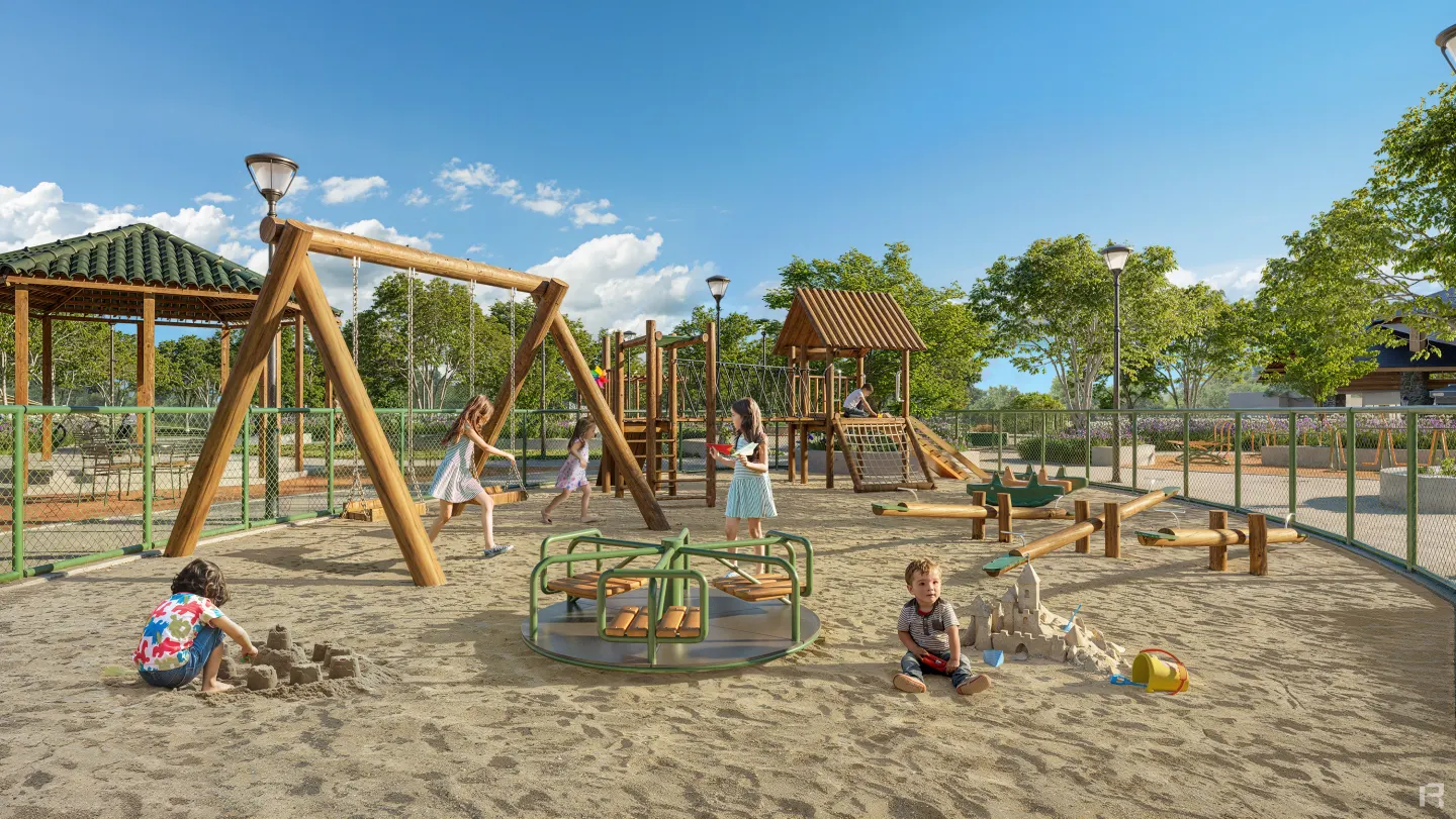Crianças brincando no playground planejado do Reserva Montês, com balanços e caixa de areia.